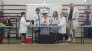 Group of children performing science experiments